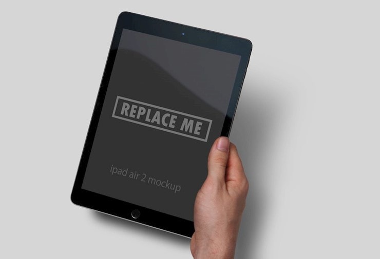 ipad-in-hand-mockup-free-black